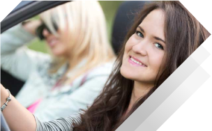 happy driving woman with good car insurance